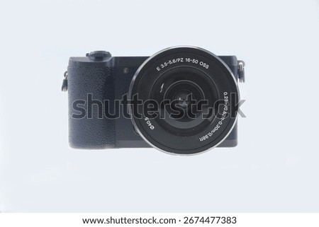 digital mirrorless camera, compact professional camera with interchangeable lens, body with a textured grip for secure handling, compact camera, for photographers, camera isolated on white background