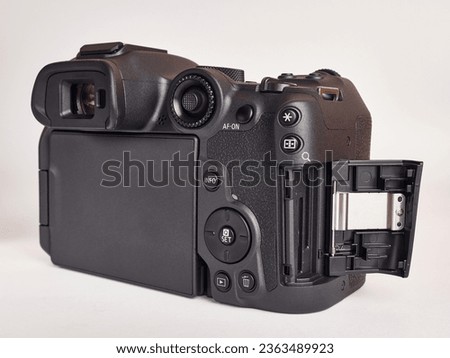 Digital mirrorless camera, side view of memory card slot.