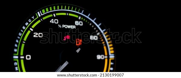 Digital modern dashboard\
in a electric vehicle - EV while charging at the charging station,\
battery electric vehicle or BEV. Dashboard in the vehicle showing\
charging status.
