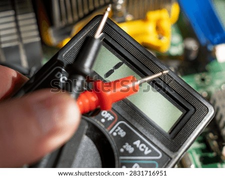Digital Multimeter Measuring Voltage in Electronics