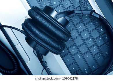 Digital Music Composer Theme. Modern Laptop Computer And Large Professional Headphones. Digital Music Composer Workstation. Technology Photo Collection