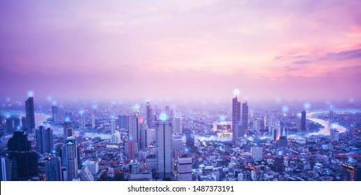 Digital network connection technology concept. Horizon pink sky and blue spot over buliding. Sunset sky river and Bangkok city of Thailand - Shutterstock ID 1487373191