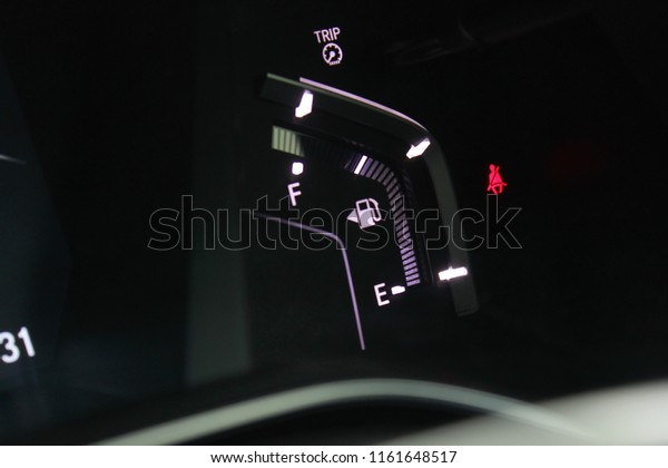 digital oil\
gasoline level sign on the\
dashboard