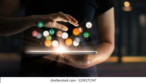 Digital online marketing commerce sale concept. Woman using tablet payments online shopping and icon customer network connection on hologram virtual screen, m-banking and omni channel. - Shutterstock ID 1159171747
