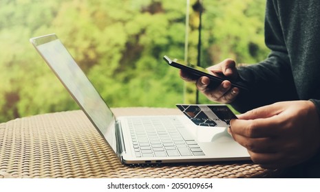 Digital Online Shopping Payment. Laptop And Credit Card For E-commerce Shopping. Connecting And Access Data. Hotel Booking On The Internet. Man Using Smartphone With Computer. Business Technology.