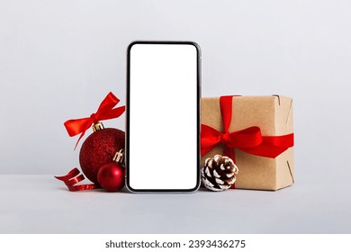 Digital phone mock up with rustic Christmas decorations for app presentation with empty space for you design. Christmas online shopping concept. Tablet with copy space on colored background. - Powered by Shutterstock