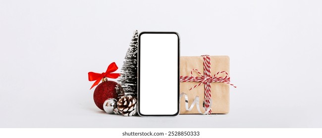 Digital phone mock up with rustic Christmas decorations for app presentation with empty space for you design. Christmas online shopping concept. Tablet with copy space on colored background. - Powered by Shutterstock