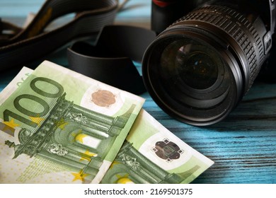 digital photo and video camera and money, store selling photographic equipment, pawnshop, closeup