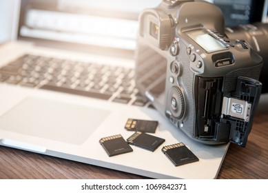 Digital Photography Workstation. Digital DSLR Camera, Laptop Computer.