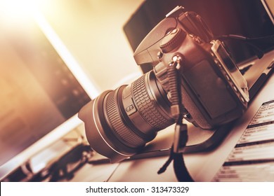 Digital Photography Workstation. Modern Digital DSLR Camera, Laptop Computer and Display. - Shutterstock ID 313473329