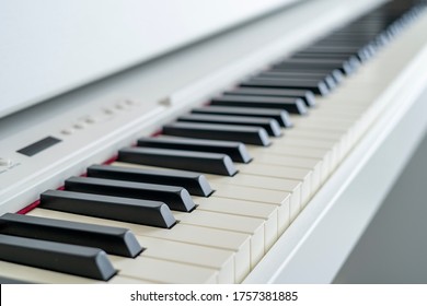 Digital Piano Looking Over The Keys. Shallow Depth Of Field. Classical Music On Electronic Digital Piano. Beautiful Piano Keys Close Up.