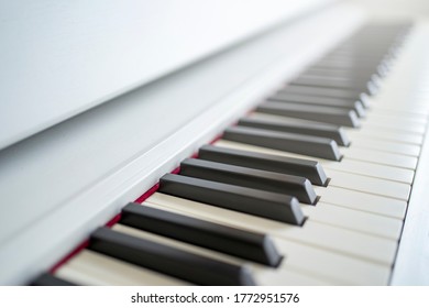 Digital Piano Looking Over The Keys. Shallow Depth Of Field. Classical Music On Electronic Digital Piano. Beautiful Piano Keys Close Up.