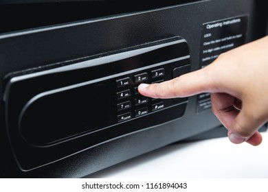 Digital Safety Safe Box In Hotel Room Service With Hand Using Finger At Password Key Pad