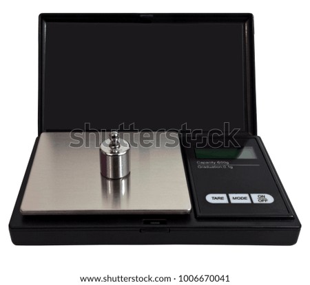 Digital scale with steel calibration weight. Isolated.