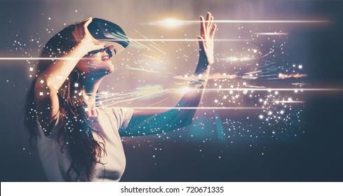 Digital Screen with young woman using a virtual reality headset - Shutterstock ID 720671335