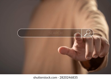 Digital search interface with user selecting an online search bar, representing internet search, information retrieval, SEO strategy, web browsing, online discovery, and digital research technology.