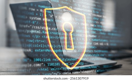 Digital shield icon with keyhole over programming code and laptop on desk background, symbolizing cybersecurity, data protection, and innovation