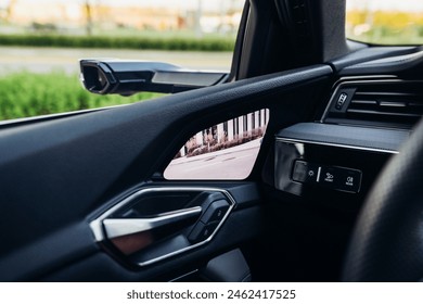 Digital side mirror and camera view inside the car.