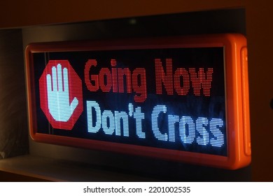 Digital Sign Stop Going Now Don't Cross With LED Screen And Red Halt Hand Icon Symbol