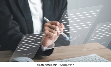 Digital Signature or e-signature and Paperless workplace concept. Businessman using stylus pen write signing on virtual screen document file acceptance work on network connection. - Shutterstock ID 2201809447