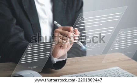 Digital Signature or e-signature and Paperless workplace concept. Businessman using stylus pen write signing on virtual screen document file acceptance work on network connection.