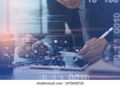 Digital software technology development concept. Businessman, coding programmer, software developer work on digital diagram via tablet with computer code, technology icons, binary on virtual screen