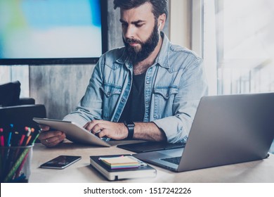 Digital specialist sitting at desk and working on project using wireless devices. Manager learning data on product in web. Online solutions and programs for engineering, design, marketing, development