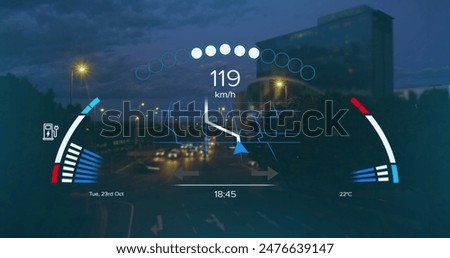 Digital speedometer display with various indicators and metrics. cityscape with streetlights and buildings visible in background