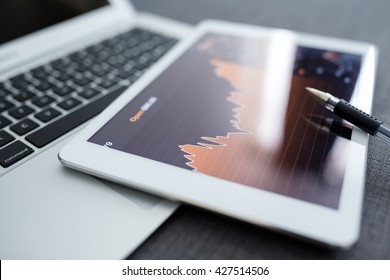 Digital stock market chart on a tablet screen