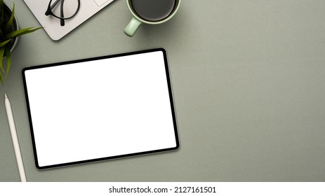Digital tablet blank screen mockup for montage your graphic display in modern grey workspace background. top view, flat lay - Shutterstock ID 2127161501