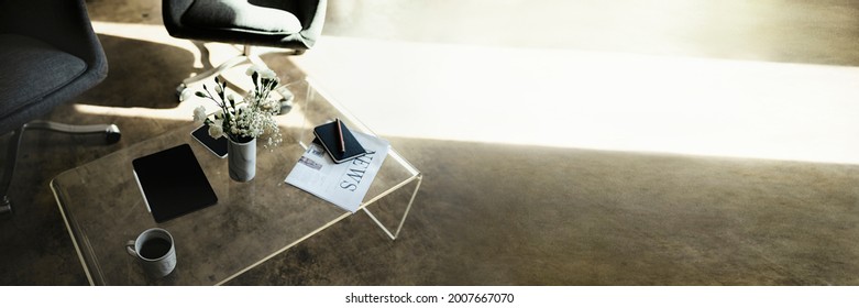 Digital tablet by a vase with white carnation flowers