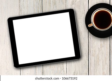 Digital Tablet And Coffee Cup On Wooden Table