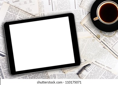 digital tablet and coffee cup on newspapers - Powered by Shutterstock