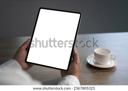 Digital tablet computer close up man using tablet hands man multitasking with isolated screen