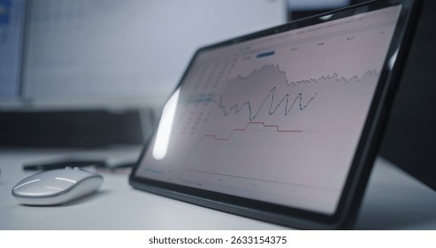 Digital Tablet and Computer with Multi-Monitor Desktop System Displaying Online Trading Software. African American Stock Exchange Trader Analyzing Real-Time Stocks, Exchange Market Charts. Close Up.