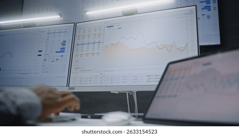Digital Tablet and Computer with Multi-Monitor Desktop System Displaying Online Trading Software. African American Stock Exchange Trader Analyzing Real-Time Stocks, Exchange Market Charts. Close Up.