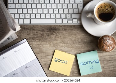 Digital tablet computer with sticky note paper and cup of coffee on old wooden desk. Simple workspace or coffee break in morning - Powered by Shutterstock