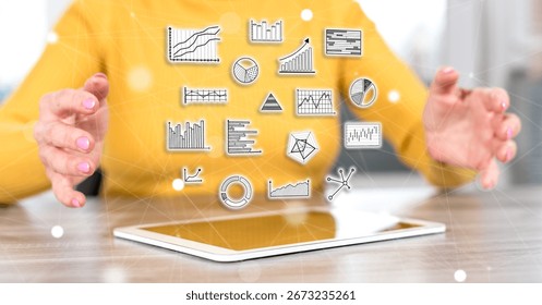 Digital tablet with data analysis concept between hands of a woman in background