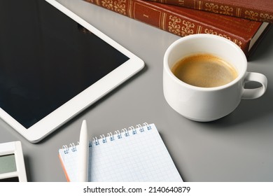 Digital tablet with empty screen on table with business accessories, close up