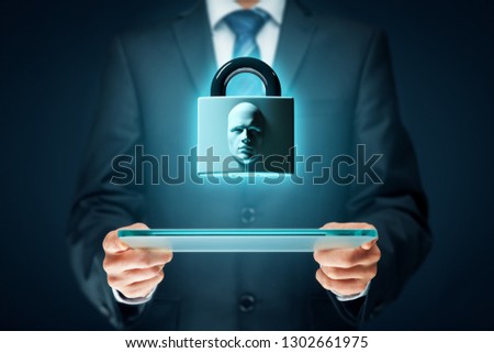 Digital tablet face detection and identification (ID) concept. Padlock with face is metaphor of unlocking tablet via face identification.