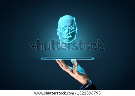 Digital tablet face detection and identification (ID) concept. Facial recognition protection and security.
