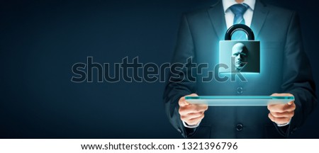 Digital tablet face detection and identification (ID) concept. Padlock with face is metaphor of unlocking tablet via face identification.
