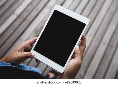 digital tablet in hand on top angle view