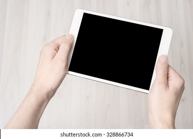 Digital Tablet In Hand, On A White Background, Isolated