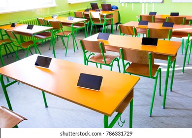 Digital Tablet On Table In Classroom At School