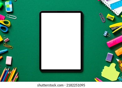 Digital Tablet Pad Mockup With School Supplies On Green Background. Flat Lay, Top View, Copy Space. Back To School Concept.