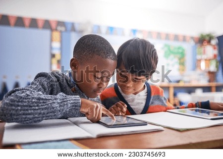 Digital tablet, school and students in classroom doing research for work, test or exam. Technology, education and boy children friends working on project or assignment together with mobile on campus.