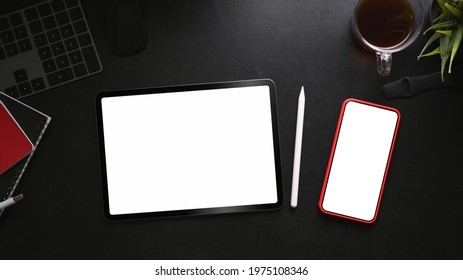 Digital tablet, smart phone, coffee cup and notebook on black leather. - Powered by Shutterstock