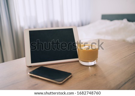 Digital tablet touch pad computer on the able, work from home, coffee, phone, room