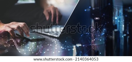 Digital technology, big data, internet network connection, futuristic innovation technology background. Man using mobile phone and laptop and smart city